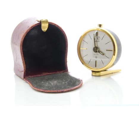 A 1960s Jaeger Retical travel alarm clock, gilt and black lacquered case, appears to run, in leather fitted box, door loose, 