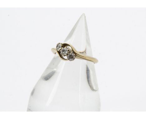 An Art Deco period three stone diamond ring, in crossover style 18ct gold mount, 2.9g and size M 