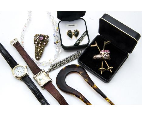 A small collection of vintage and modern jewellery, including a ski pole and boot brooch, two hair grips and more, also two w