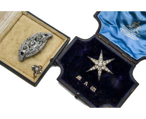 A vintage continental silver and paste star brooch, together with a Howell & James box, a paste set ring and an Art Deco past