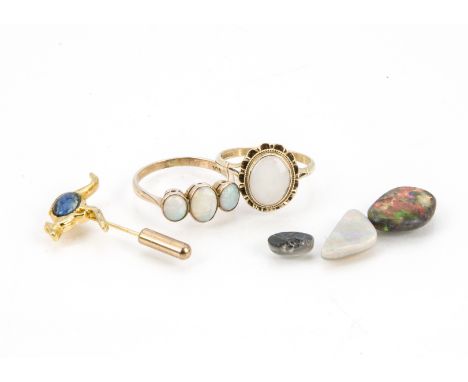 Two 9ct gold and opal rings, together with three loose opals and an Australian stick pin (6) 