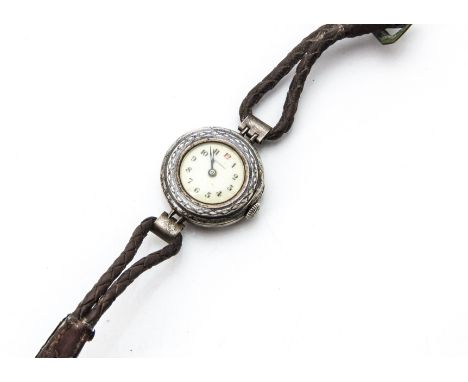 An early 20th century Eterna silver trench style wristwatch, with blue enamel to the bezel, AF, marked Eterna to dial, appear