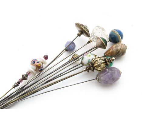 A group of ten vintage and modern hat pins, each with hardstone, glass or metal finial (10) 