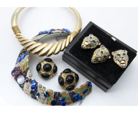 A collection of vintage and modern costume jewellery, including several large pairs of earrings, and necklaces and a three pi