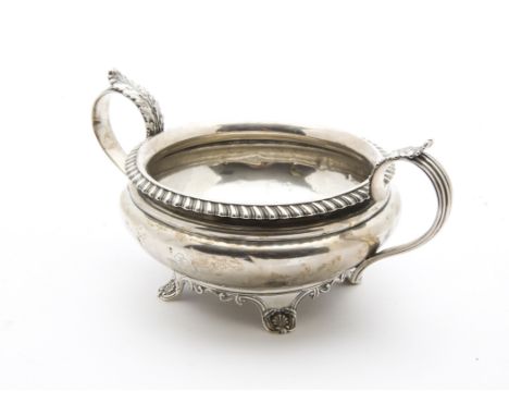 A George III silver sugar basin, Possibly by CR DR, with twin acanthus leaf handles, bearing engraved family crest of a post 