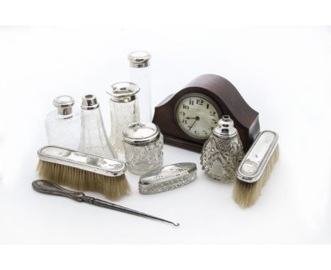 A group of seven Victorian and later cut glass and silver mounted dressing table items, together with a pair of silver backed