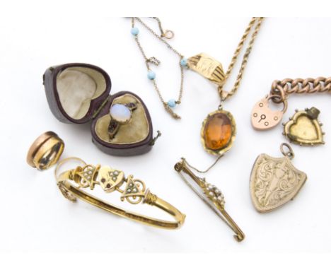 A collection of Victorian and later gold and other jewellery, including a curb link chain bracelet with heart shaped clasp, a