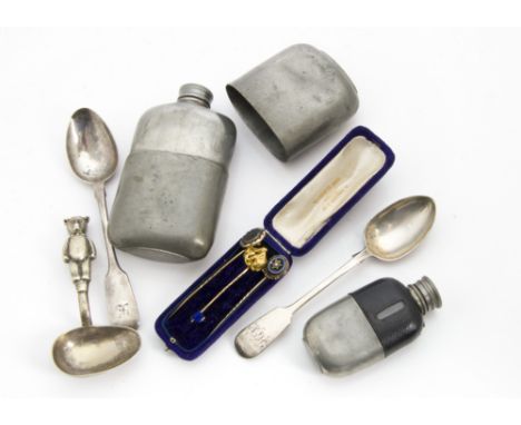 A late 19th century gold nugget stick pin, 6.7g, together with two further stick pins and a case, a miniature hipflask, a pew