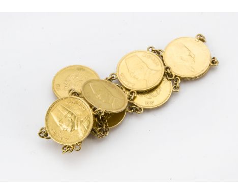 A vintage Egyptian Fuad I 50 Piastres gold coin bracelet, the seven 1923 gold coins with links and a box clasp supporting a f