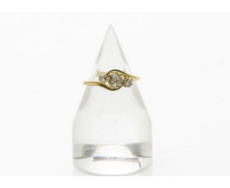 A Victorian three stone diamond ring, the old cuts in crossover 18ct gold mount, 2.9g and size S 