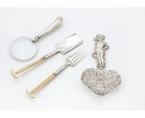 A Victorian silver and ivory handled butter paddle and fork, together with a Victorian silver wedding spoon and a silver hand