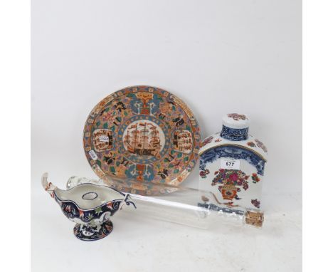 A Chinese export ceramic plate, with character mark on base, large blue and white floral tea caddy etc (4) 