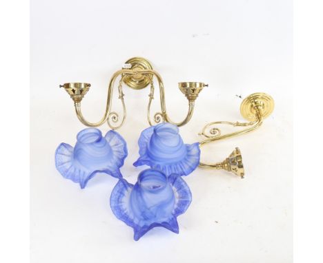 A Christopher Wray brass twin-branch wall light fitting, with frilled blue glass shades, and a matching single wall light fit