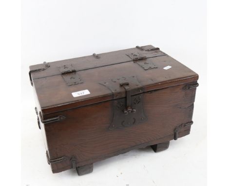 A small scale stained oak table-top metal-bound trunk, W40cm, H23cm, D26cm 