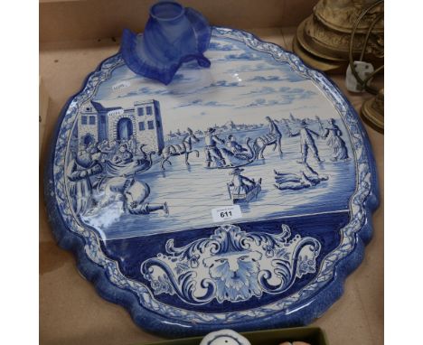 A large Dutch Delft blue and white ceramic wall plaque, ice skating scene, 58cm x 48cm 