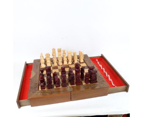 An Oriental folding games box, with chess board and chessmen 