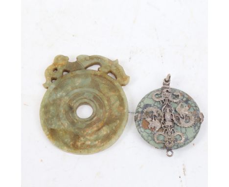 A Chinese Archaic style jade disc amulet, and a similar white metal mounted turquoise dragon example, largest diameter 8cm (2
