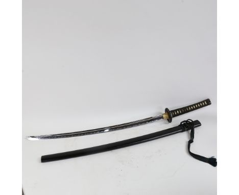 A modern Japanese Katana sword, with dragon and pearl decorated menuke and tsuba, blade length 72cm, in scabbard 