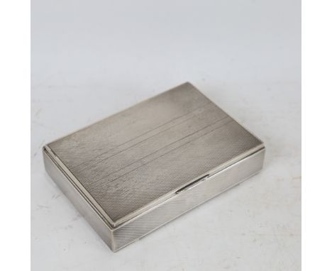 A Danish sterling silver engine turned cigarette box 