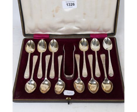 An Edwardian cased set of 12 matching silver teaspoons and a pair of sugar tongs, by W S Savage &amp; Co, hallmarks Sheffield