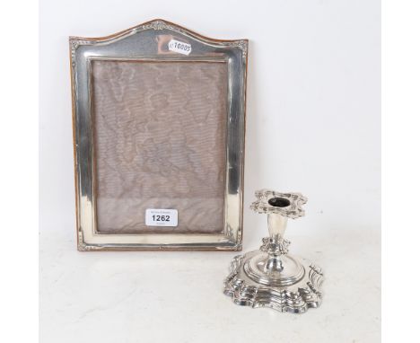 An unmarked silver rectangular photo frame, and a Danish silver squat candlestick (2) 