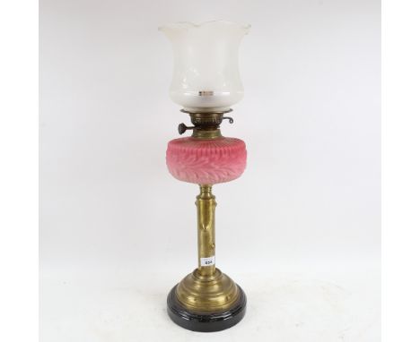 A brass and pink opalescent glass oil lamp, with etched glass shade, overall height including shade 65cm 