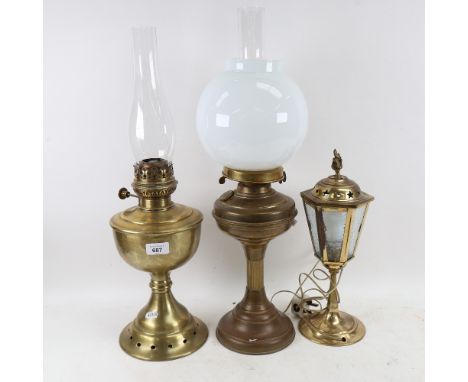 A Vintage brass duplex oil lamp, with milk glass shade and glass funnel, another similar, and a lantern table lamp, largest h