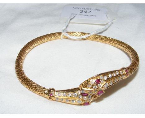A ladies 21ct snake bangle set with diamonds and ruby
