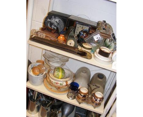 A sundry lot of collectables, including bed warmers, ceramic jelly mould and musical recorder - on two shelves 