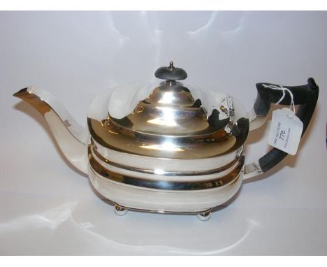 A silver teapot with Sheffield hallmark 