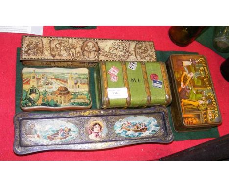 A Macfarlane Lang biscuit tin in the shape of a travelling trunk, together with four other tins 