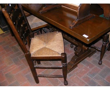 A refectory style dining table with a set of eight ladder-back chairs - the table measuring 210cm x 80cm 