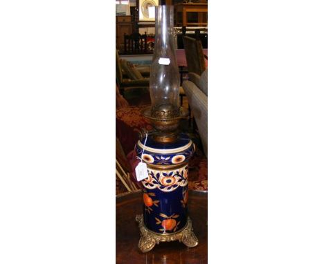 A ceramic and metal Victorian oil lamp - 45cms high
