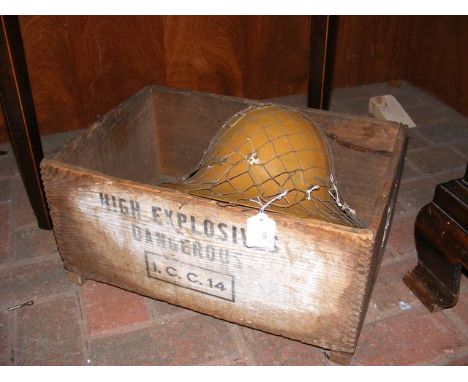 A Zuckerman steel military helmet together with an old 'high explosive' ammunition crate