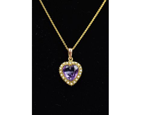 AN EARLY 20TH CENTURY AMETHYST AND SPLIT PEARL PENDANT AND CHAIN, the heart shape amethyst within a split pearl surround susp
