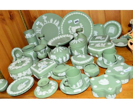A COLLECTION OF WEDGWOOD GREEN JASPERWARE, including candlesticks, trinket boxes, plates, vases, coffee cups and saucers, etc
