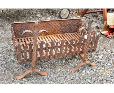 A VINTAGE CAST IRON FIRE BASKET, and two dogs