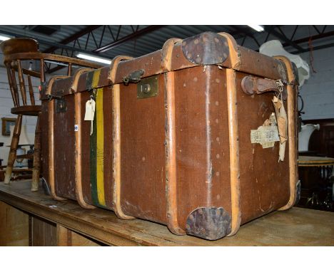 A VINTAGE WOODEN BANDED TRUNK, with travel labels, approximate size width 94cm x depth 56cm x height 51cm (sd)