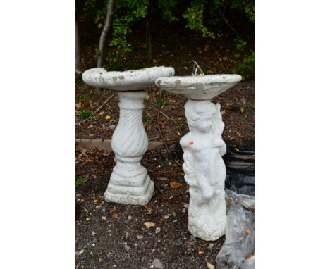 A COMPOSITE SUNDIAL ON CHERUB PEDESTAL BASE, approximate height 82cm and a composite shell bird bath, approximate height 80cm