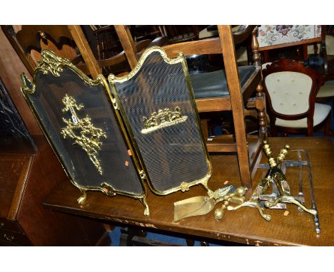 A BRASS THREE FOLD FIRESCREEN, a pair of fire dogs and fire irons
