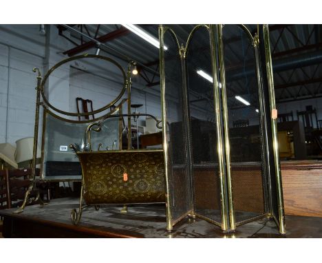 AN ARTS & CRAFTS BRASS FIRESCREEN, with mirror insert, three fold firescreen and a magazine rack (3)