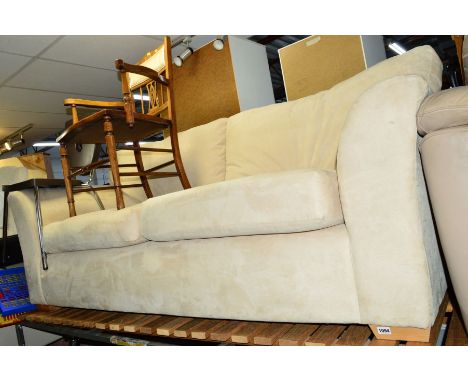 A CREAM UPHOLSTERED THREE SEATER SOFA, and a leather three seater sofa (2)