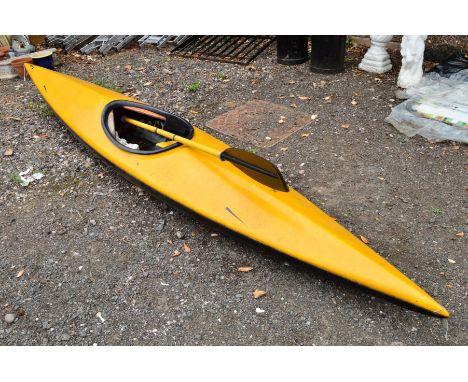A YELLOW CANOE, with double oars