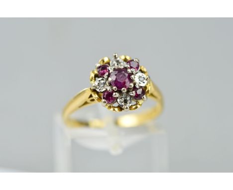 A LATE 20TH CENTURY RUBY AND DIAMOND ROUND CLUSTER RING, ring size M, stamped '18ct', approximate gross weight 4.1 grams
