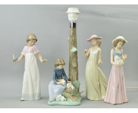 A NAO LAMP BASE, seated girl with rabbits by tree stump, approximate height 36cm, together with three Nao figurines, 'Gentle 