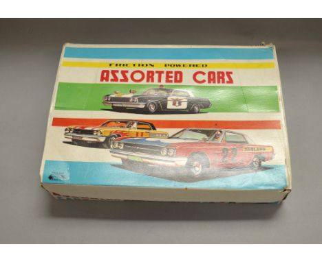 Ichimura (Japan) Friction Powered Assorted Cars, a trade box containing 24 friction drive tinplate model racing cars, length 