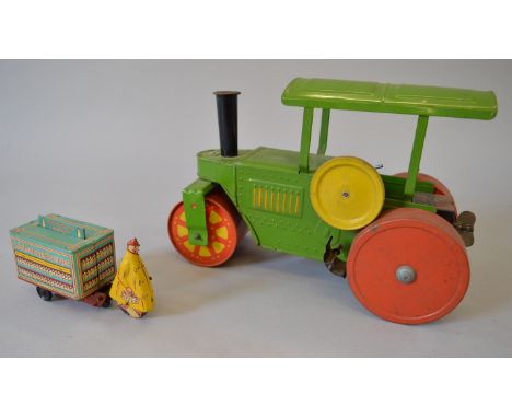 Two unboxed clockwork tinplate toys, a Welsotoys Milkman with delivery cart, G, with key, together with a large Road Roller, 