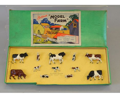 Britains Model Farm No. 122F, containing 12 cattle. All figures tied to original backing card (grubby) in G green box with pa