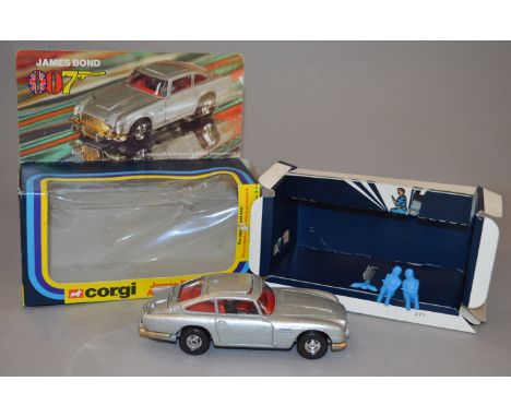 Corgi 271 James Bond 007 Aston Martin. Diecast model is silver with red interior, appears E, with James Bond and two bandit f