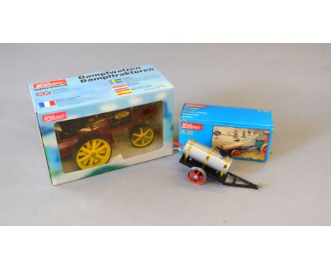 Wilesco D409 Steam Roller Traction Engine in red with yellow wheels. Appears VG, boxed. Together with Wilesco A38 Water Cart,